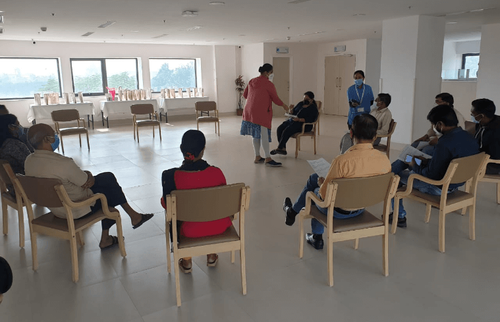 Interactive health talk by Dr. Anamika with relatives of cancer patients.